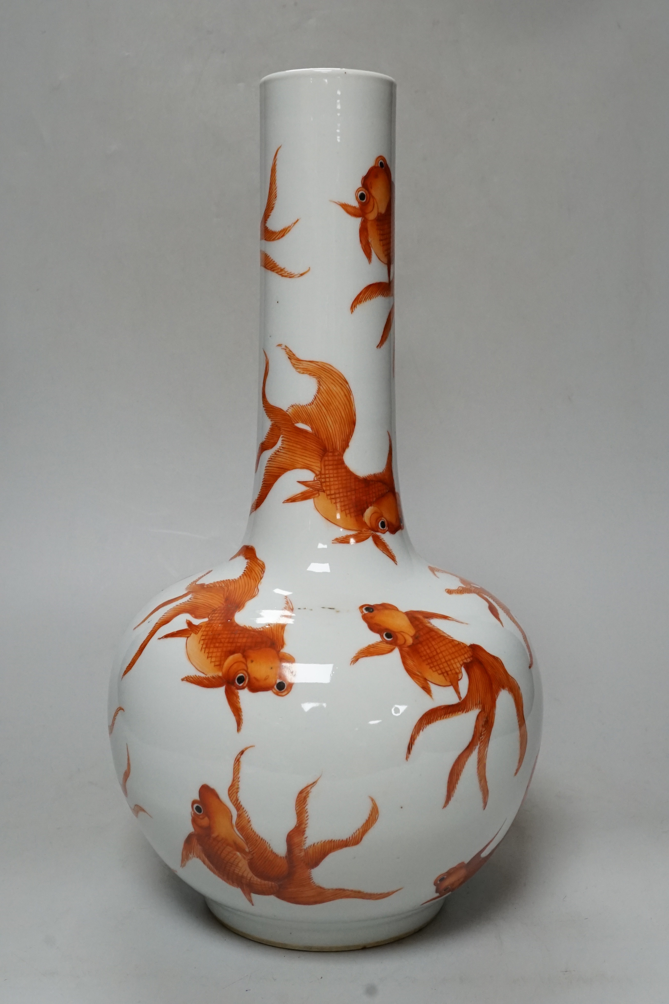 A Chinese iron red enamelled ‘goldfish’ bottle vase, 36cm tall